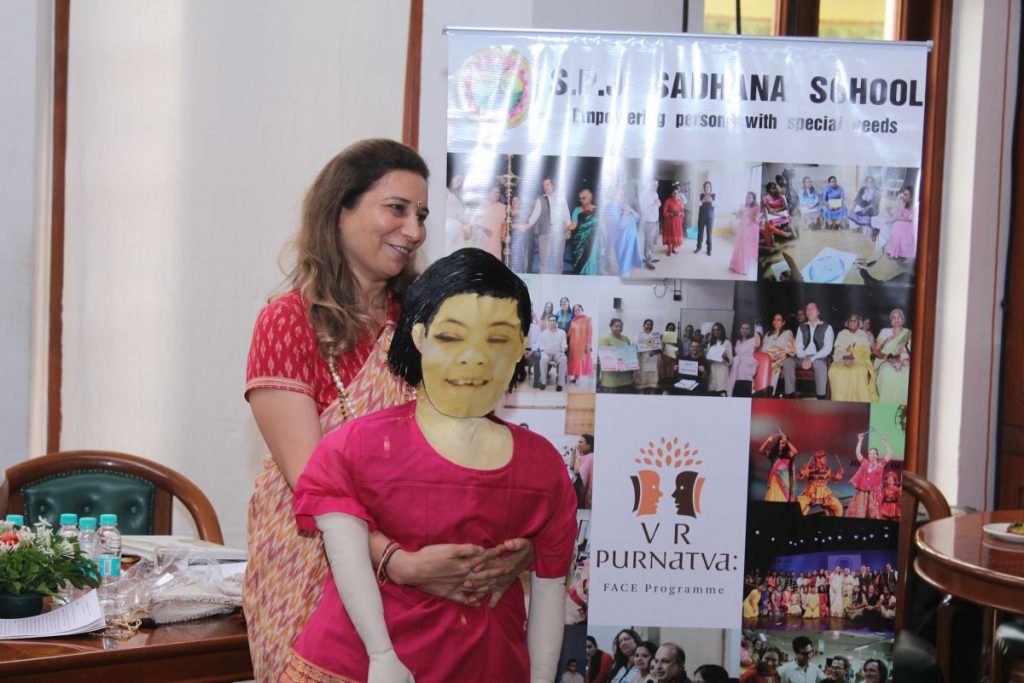 Dr. Khanna with a puppet, representing Vasudha - with her began the story of S.P.J. Sadhana School